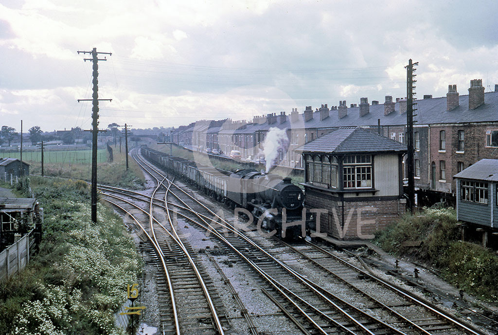 48505 working through Sandbach Junction in Cheshire with coal empties August 1967 on the left the freight branch to Middlewich SRL No 561 