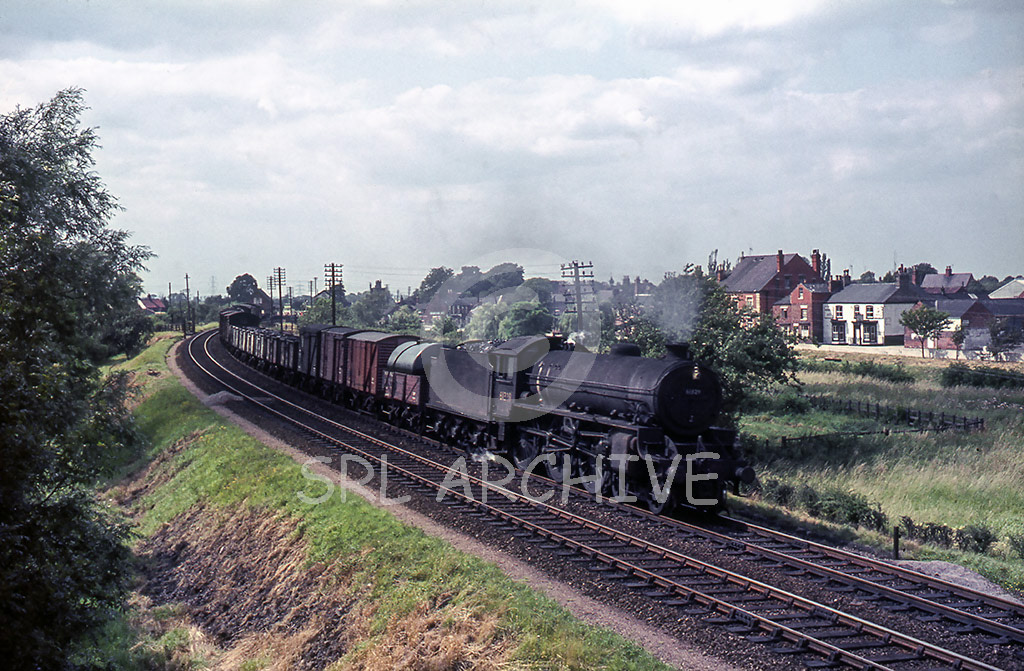 61338 at Saxilby in Lincolnshire with 7E33 Millerhill-Whitemoor freight 15th July 1964 Tony Smith/SRL No 1147 