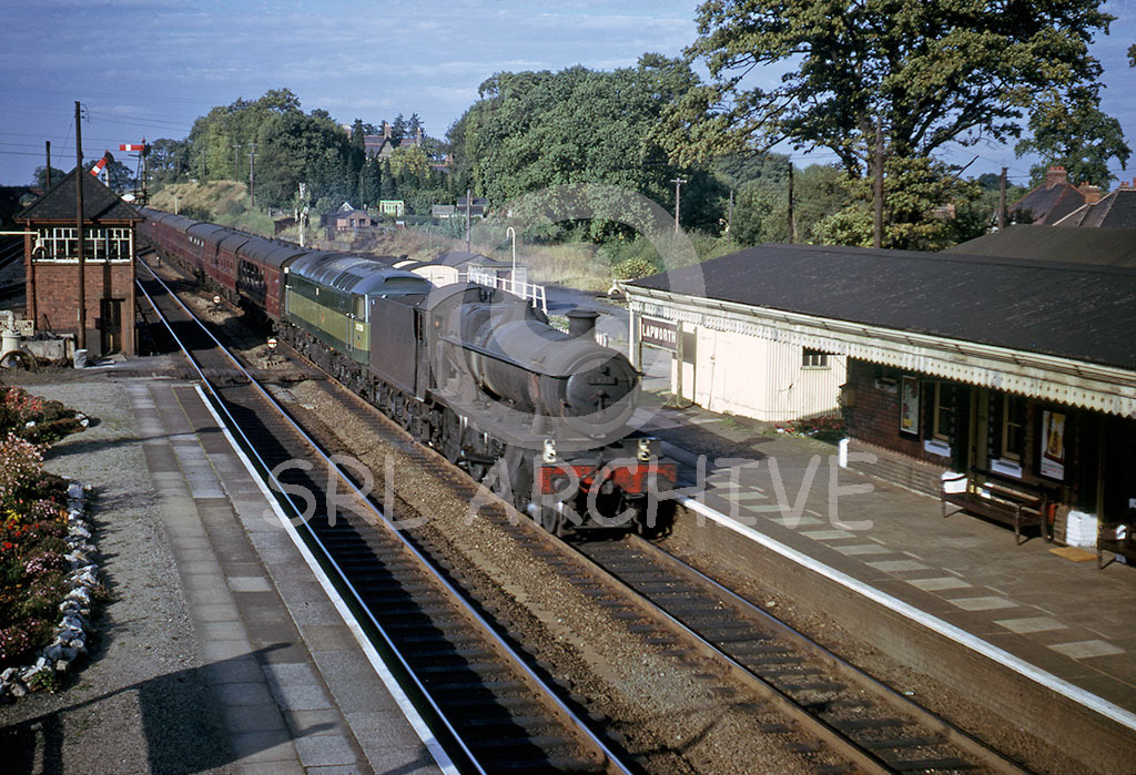 6931 'Aldborough Hall' piloting a failed (maybe)Brush Type 4 diesel electric No 1756 at Lapworth in September 1964 SRL No 556 