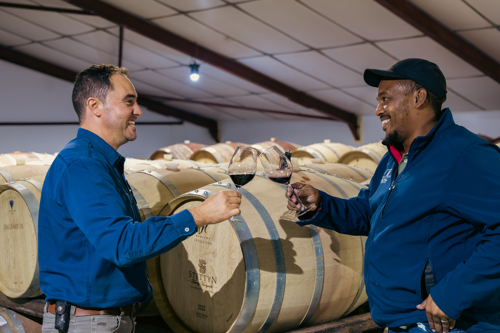 Toasting to the fruits of their labor—celebrating another successful harvest with a glass of Stettyn’s finest, a true testament to dedication and craftsmanship..