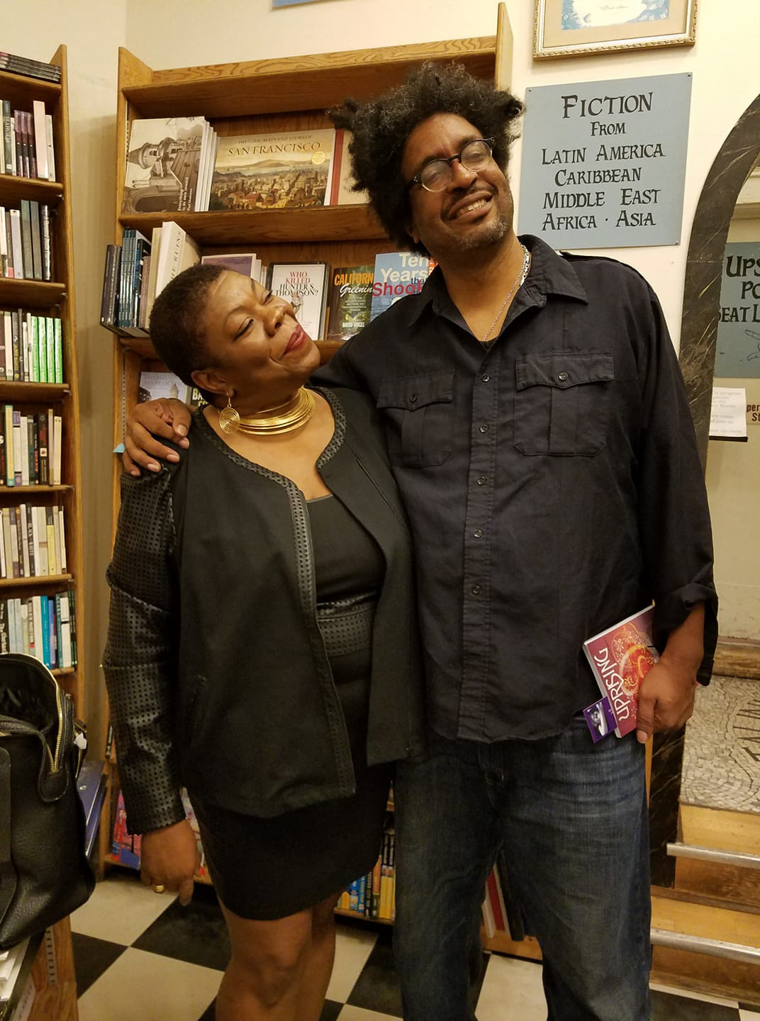 Sylvia Blalock & John Sims, holding a copy of Sylvia's book