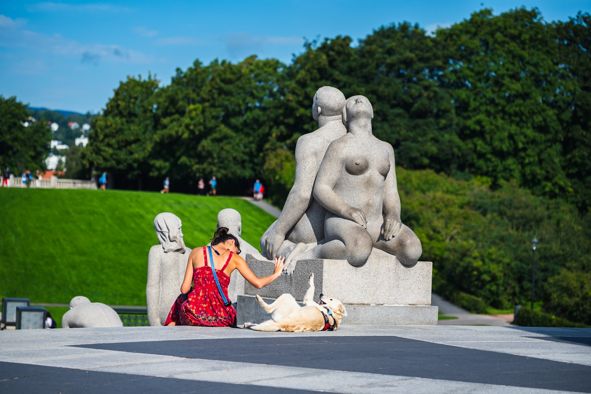 Woman playing with her dog in Oslo