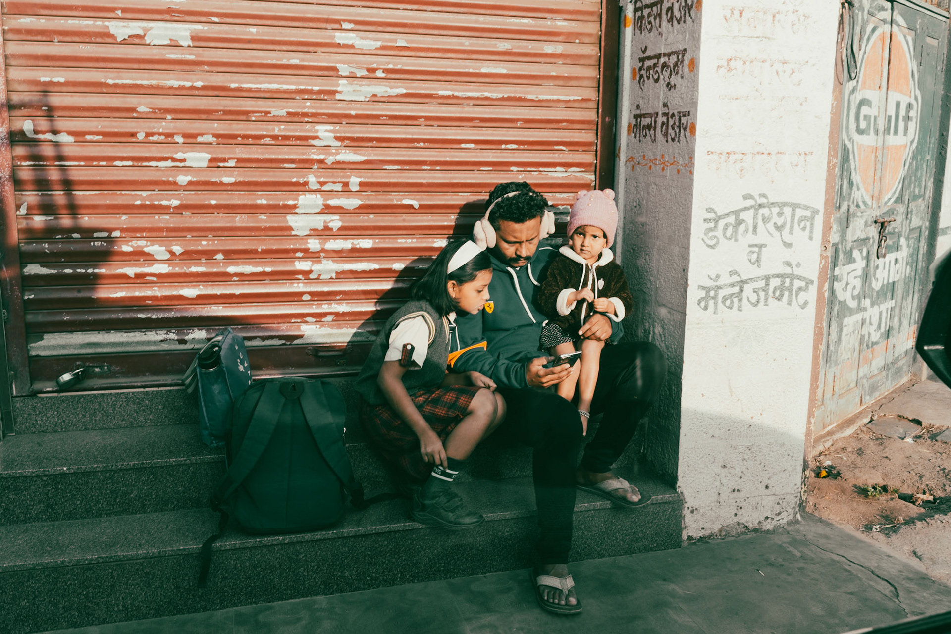 Father sitting with his kids