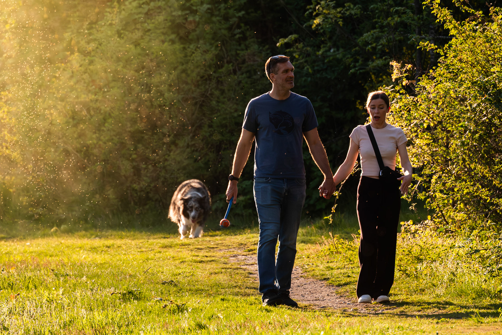 Couple walking with a dog