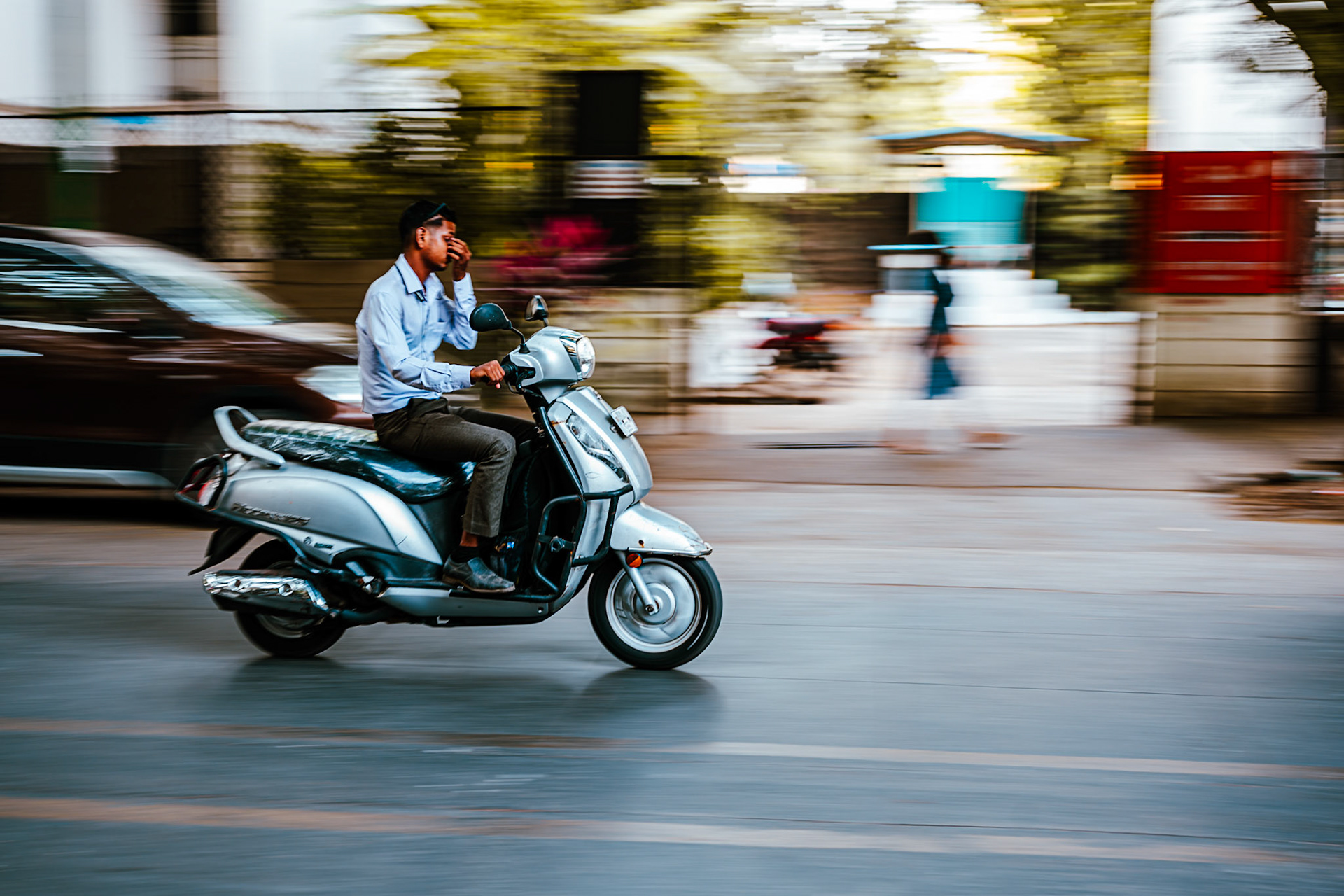 Man riding a scooter