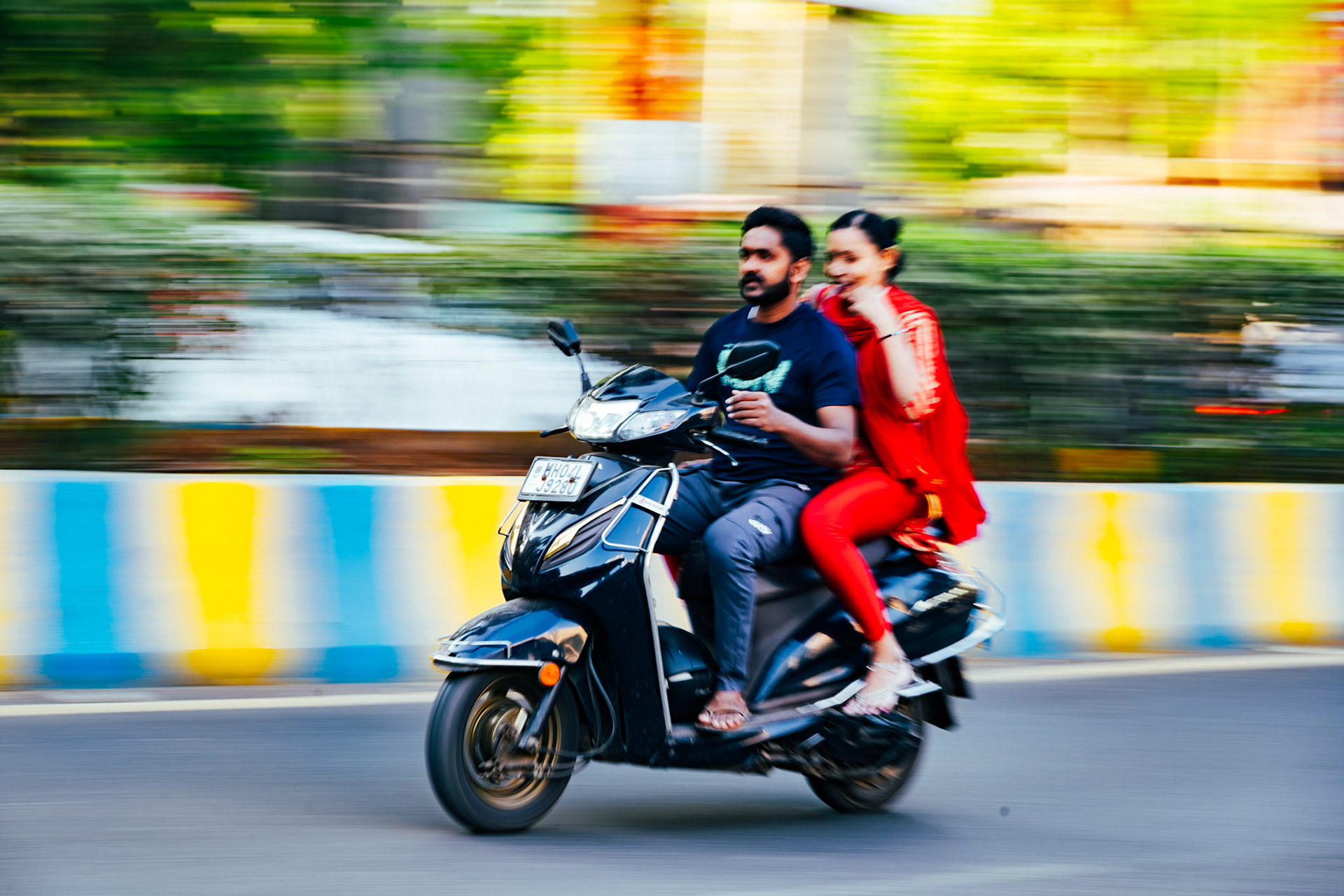 Couple riding a scooter