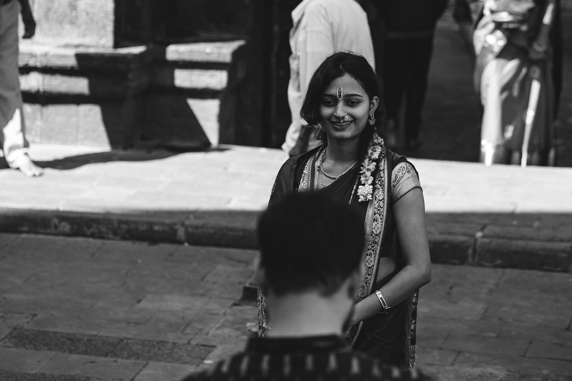 Woman getting photographed by her husband