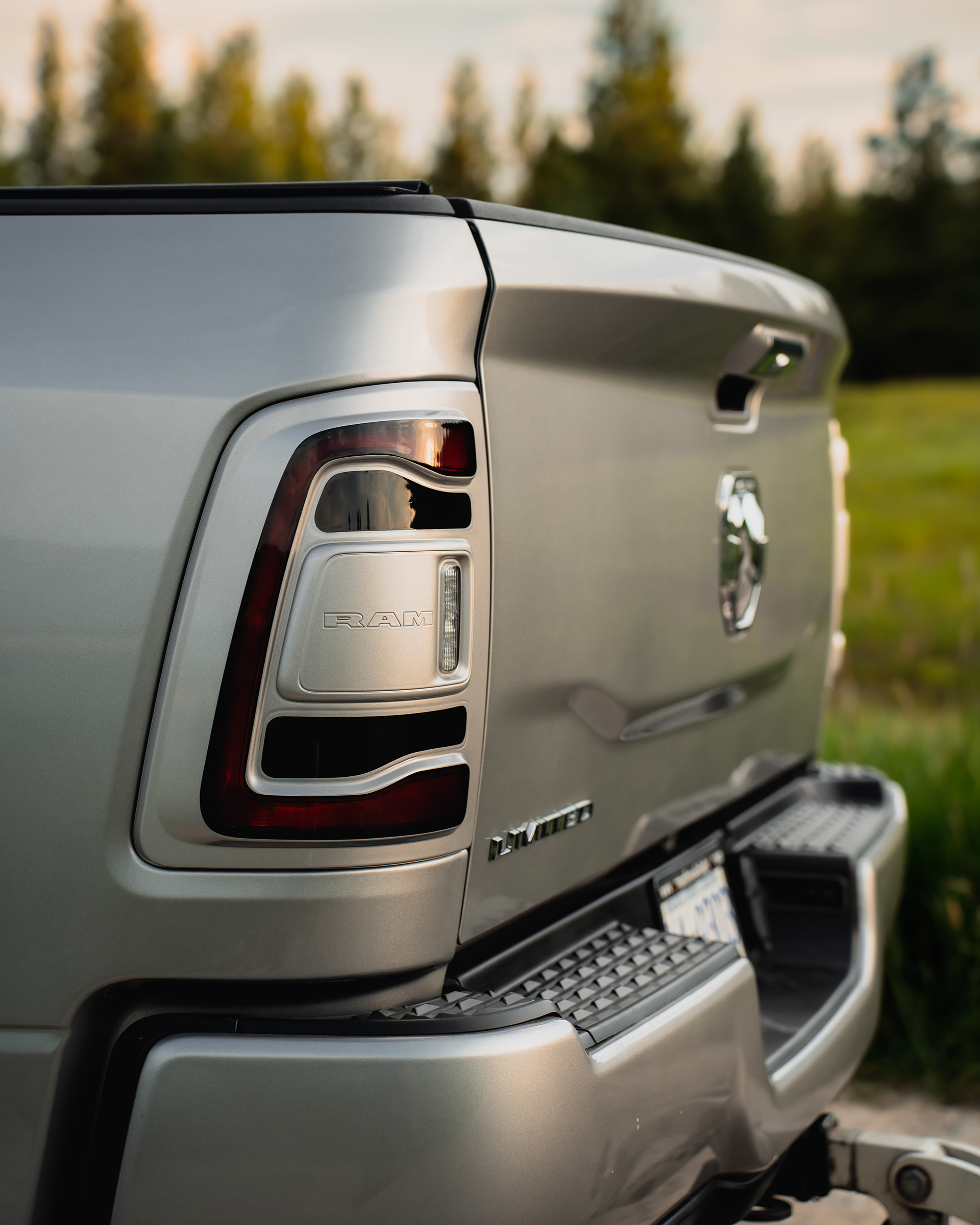 Rear detail photograph highlighting the taillight, body lines, and finish.