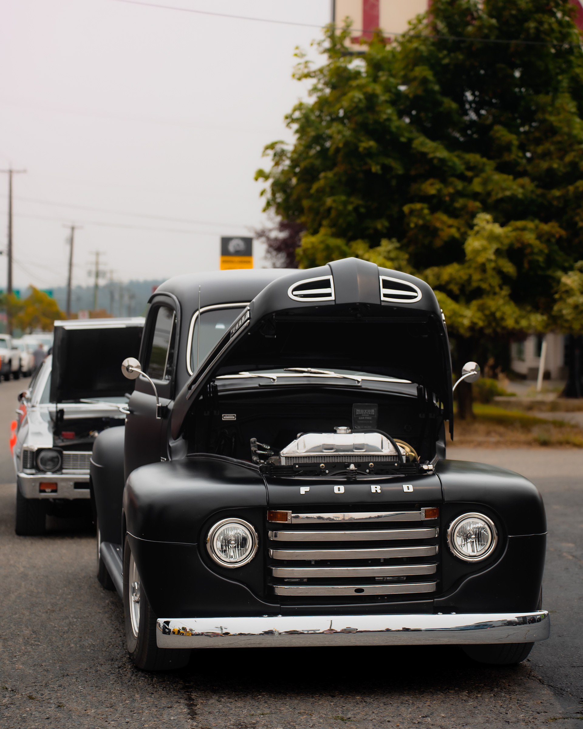 Classic Ford pickup captured during automotive event coverage.