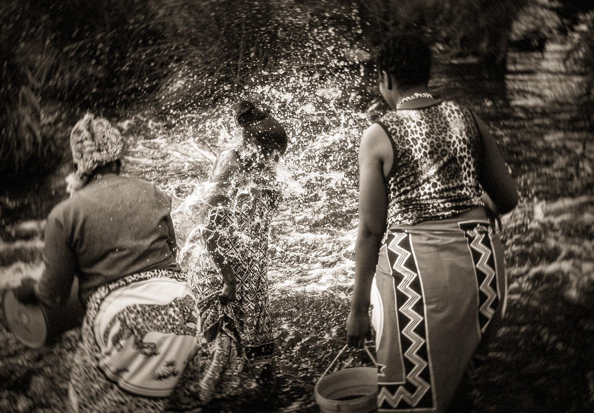 As the water hits her half-stripped body, she screams, laughs and cries invariably. 