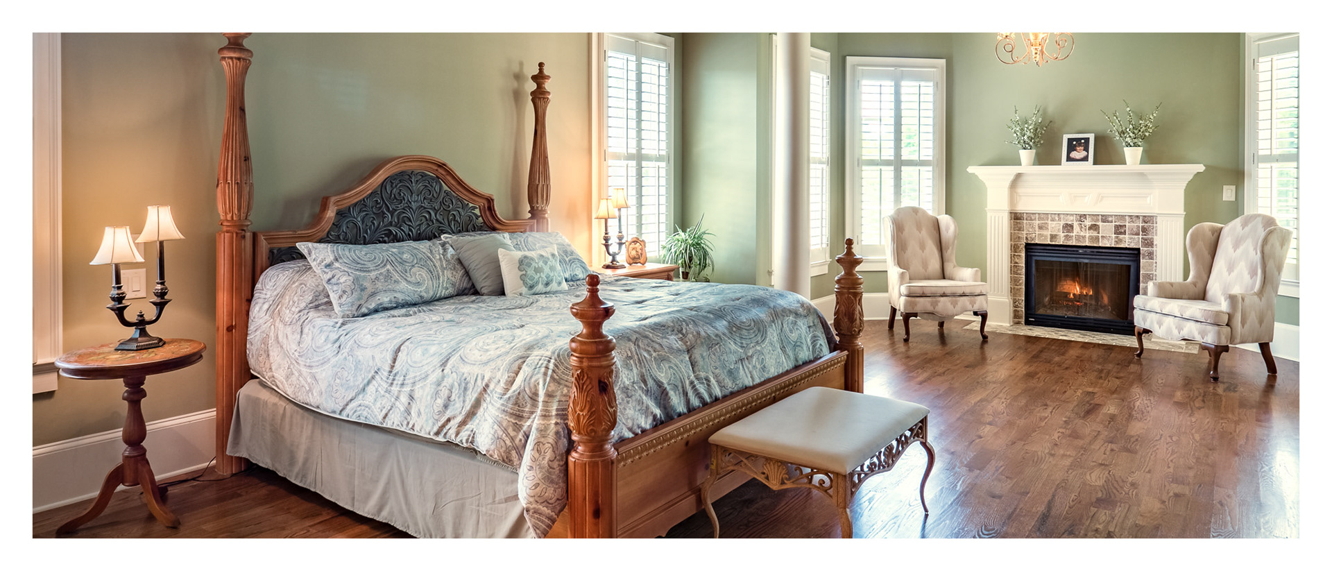 Master bedroom with fireplace in home for sale at The Manor near Alpharetta, GA.