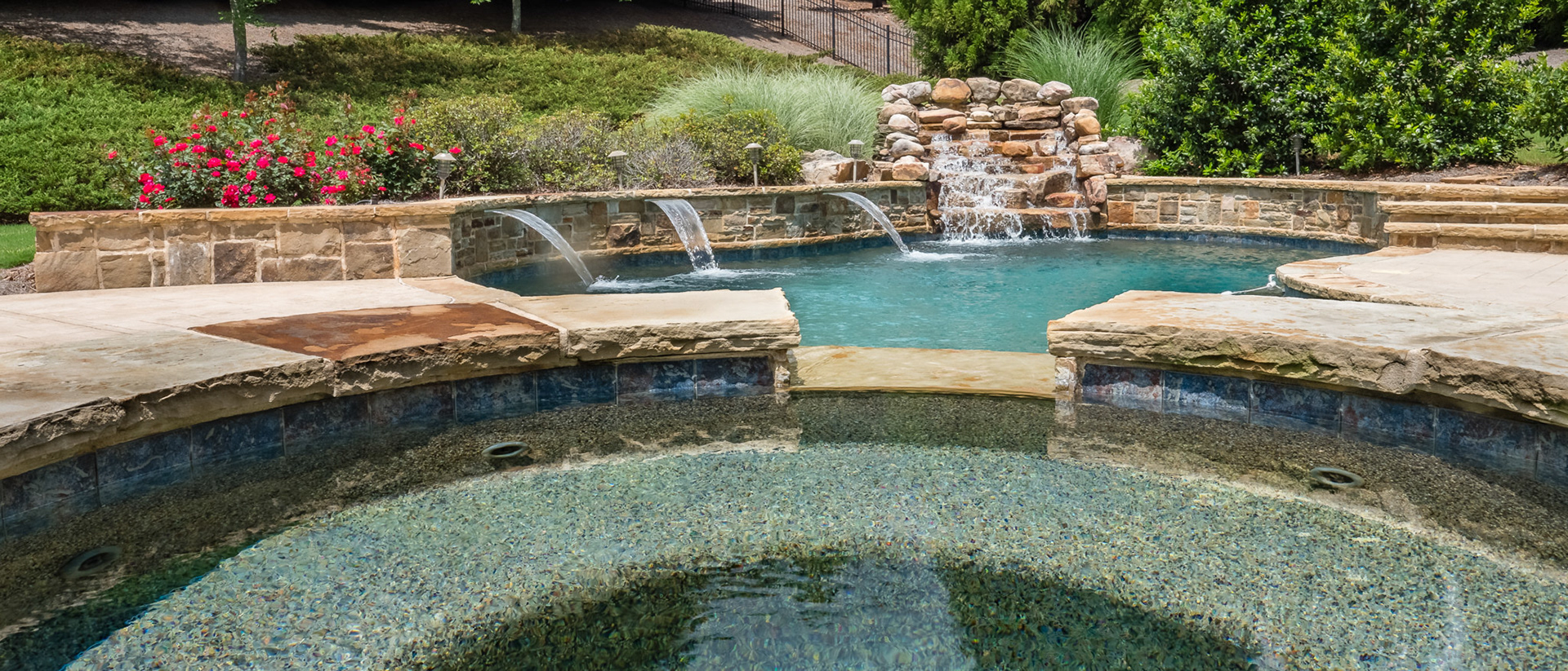 Hot tub, waterfall and shears in backyard oasis at 110 Manor Lake Court in the heart of Milton's horse country.  Photography by Cindy Kringelis of Alpharetta Photography, LLC.