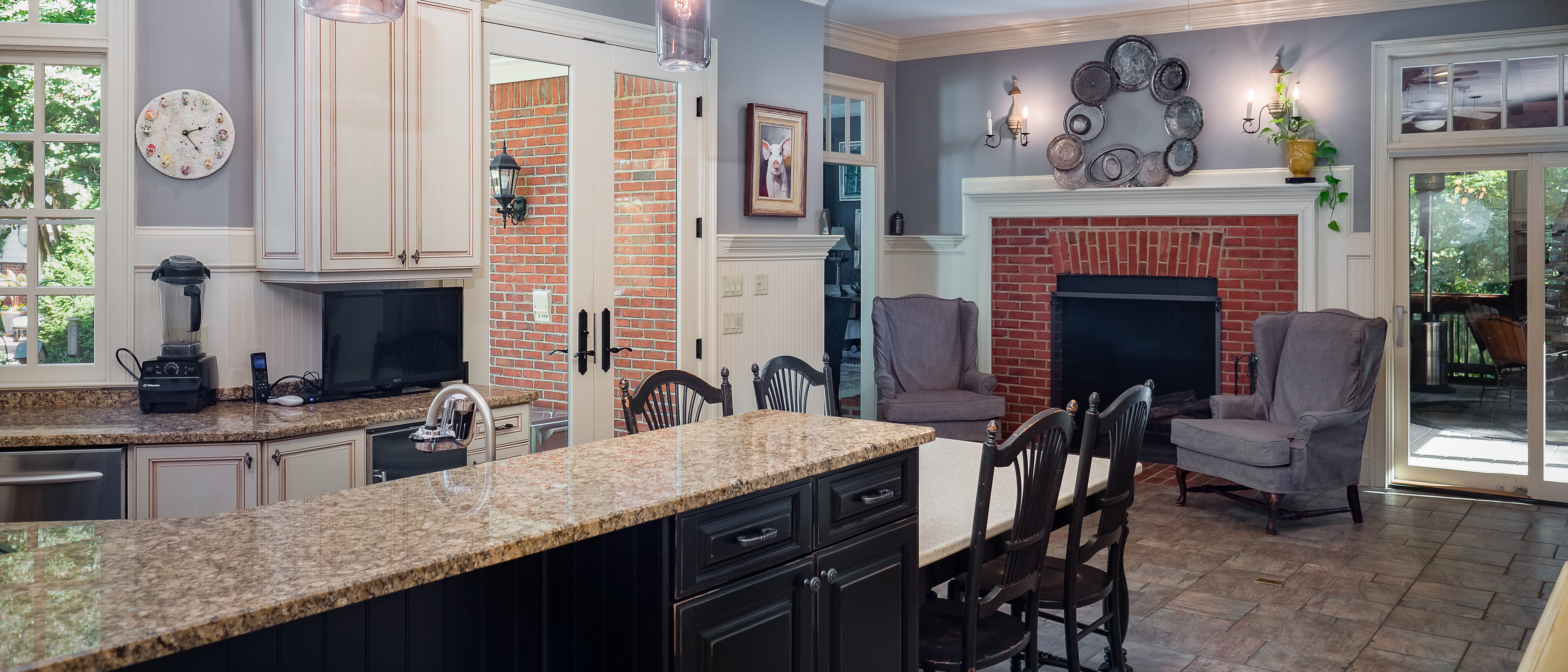 Gourmet Kitchen with fireplace photographed by Cindy Kringelis of Alpharetta Photography, LLC.