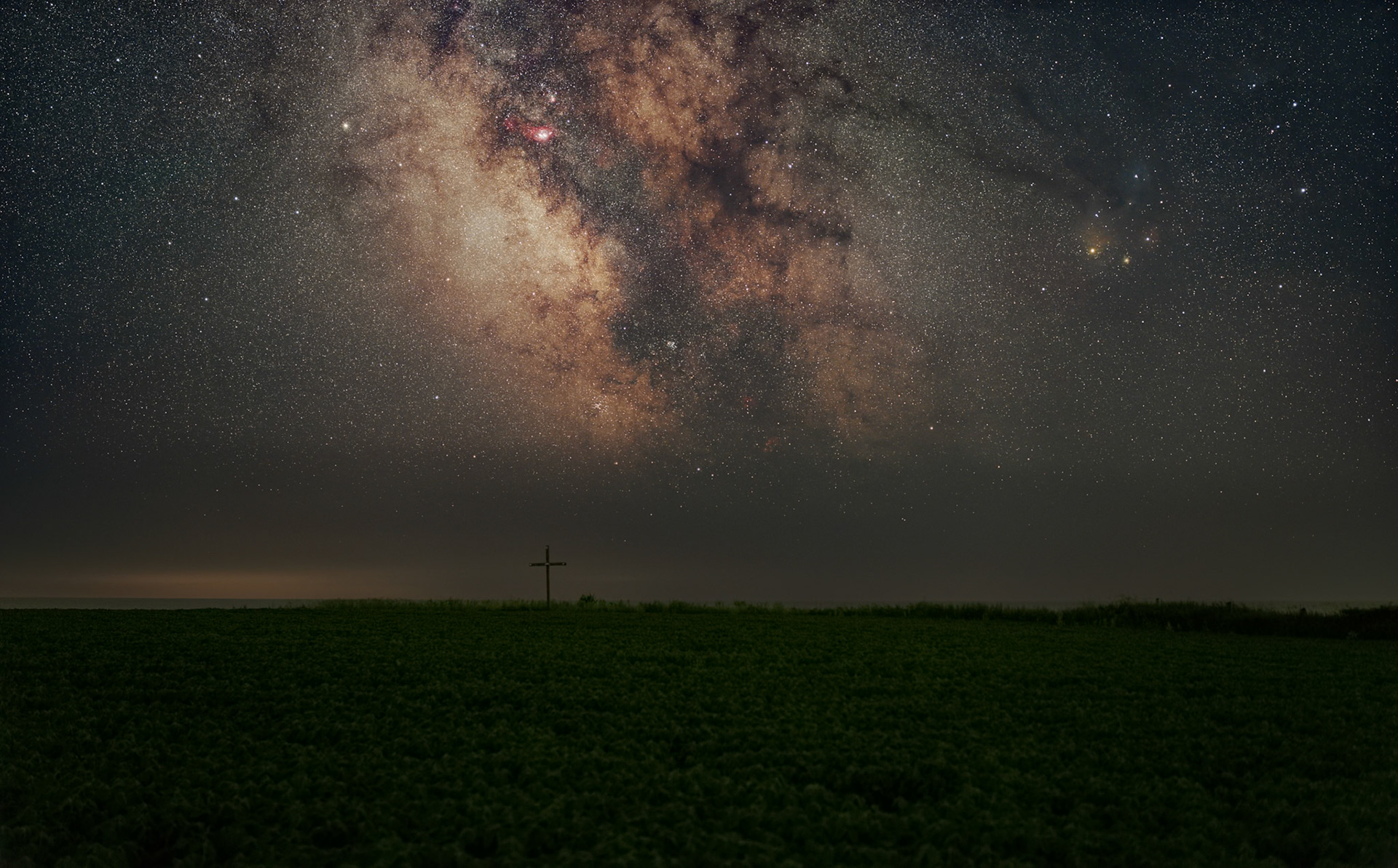 The summer Milky Way above a farm field near the Lake Ontario shoreline in southern Ontario. An opening in the clouds led me east that night, where haze along the far horizon softened the distant light while the sky overhead remained remarkably clear.