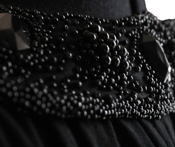 Bead embroidery details from a Dark Dawn AW 2011 eco jersey evening gown shown at D.C. Fashion Week, so durable they have survived countless rounds in the washing machine. © Rudy Wolff.