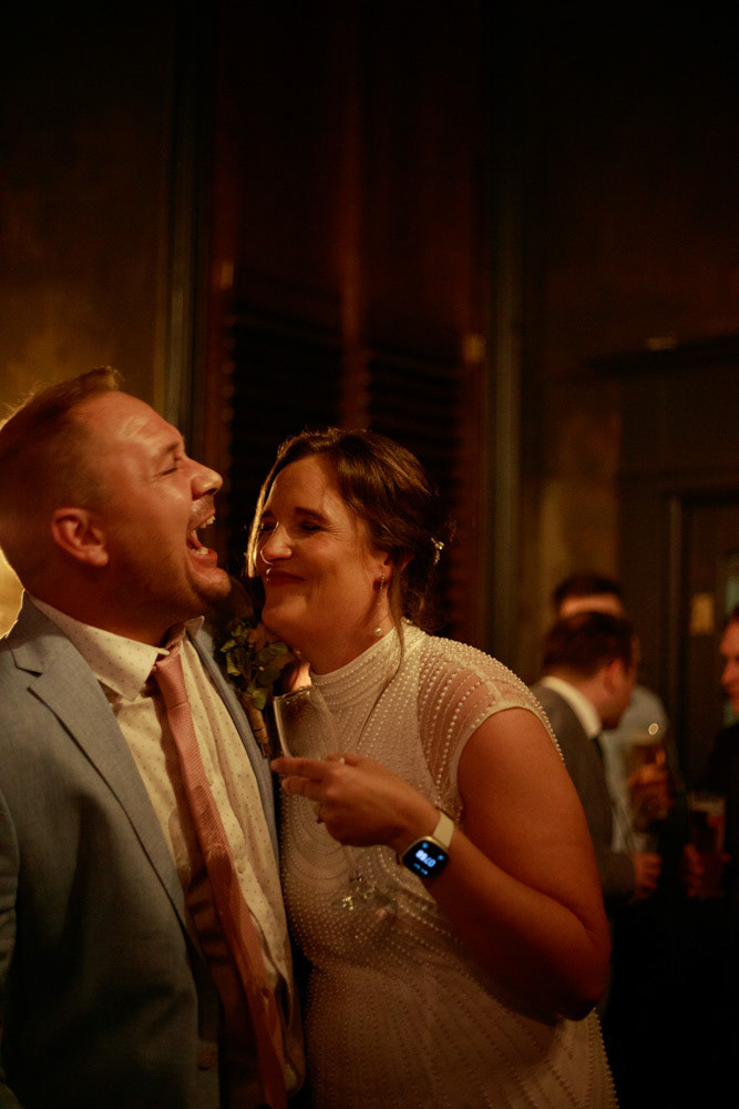 A couple laughs together during the evening