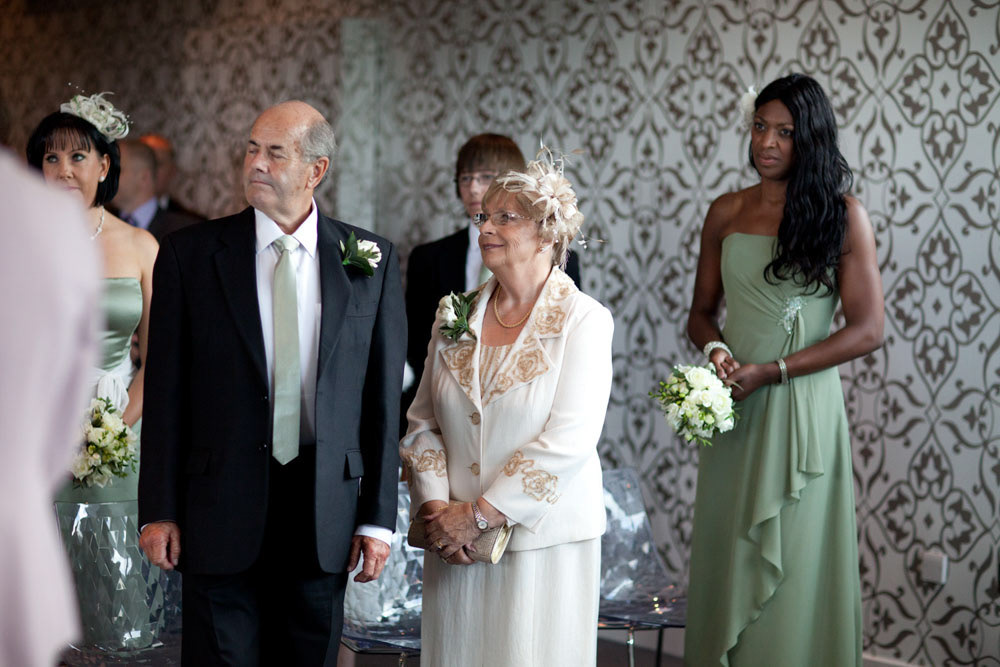 Guests watching the ceremony with quiet smiles and full hearts.
