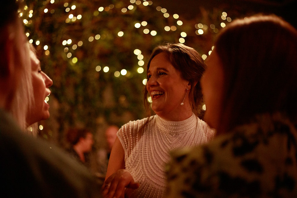 Gemma chatting under twinkling lights at Lost & Found Leeds Club