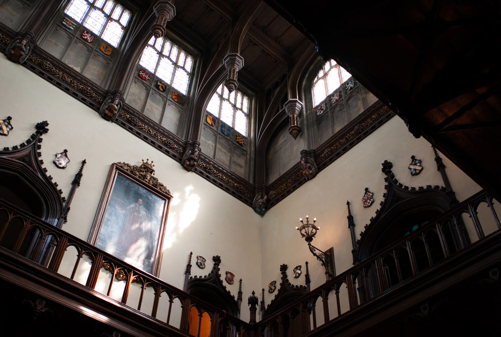 Cream walls and decorative wood panels inside Allerton Castle’s elegant interiors