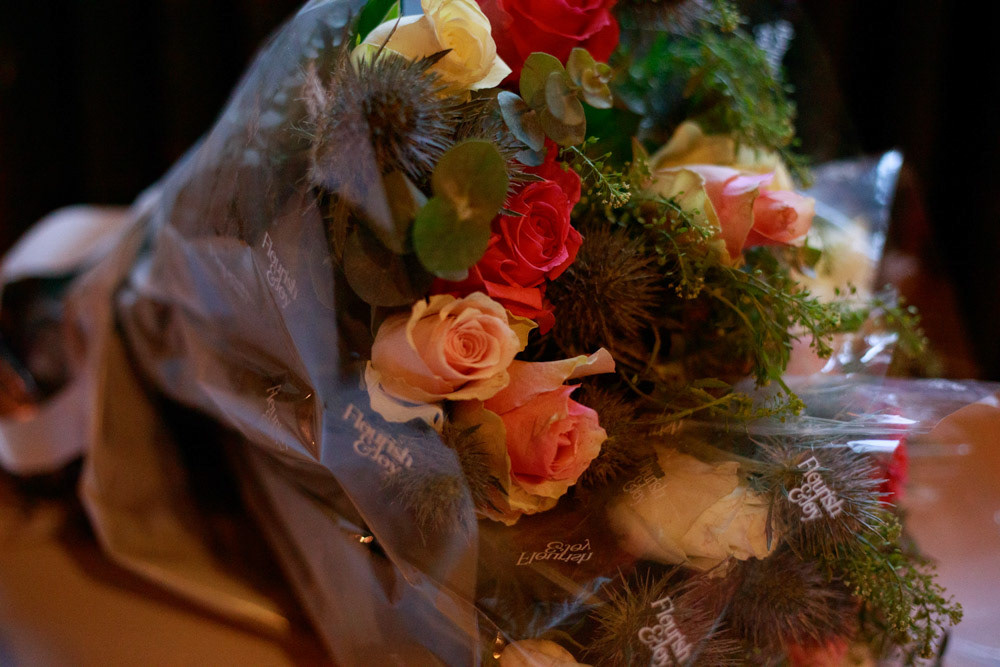 Gift bouquet for speeches on a wedding table at Lost & Found Leeds Club