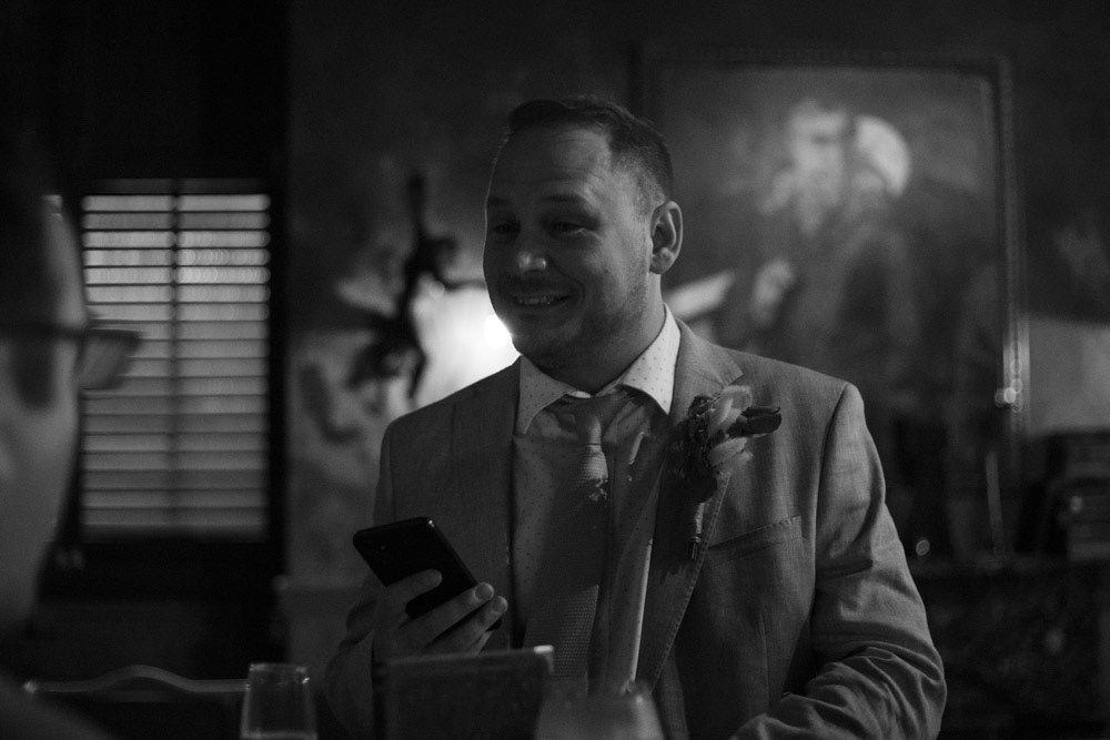 Groom shares a warm smile with his best man