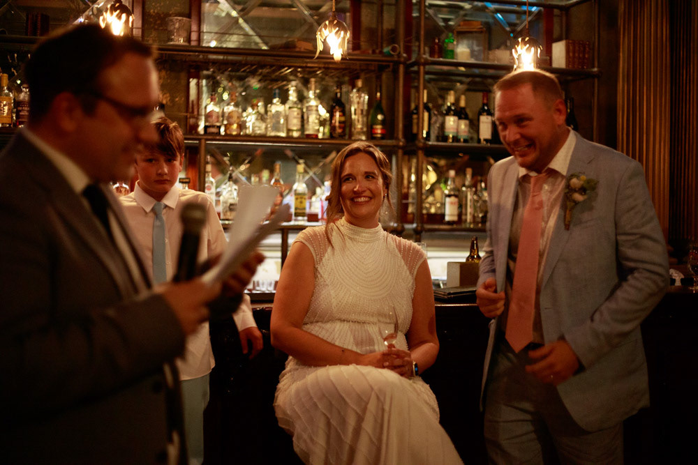 Best man begins his speech to a room of guests