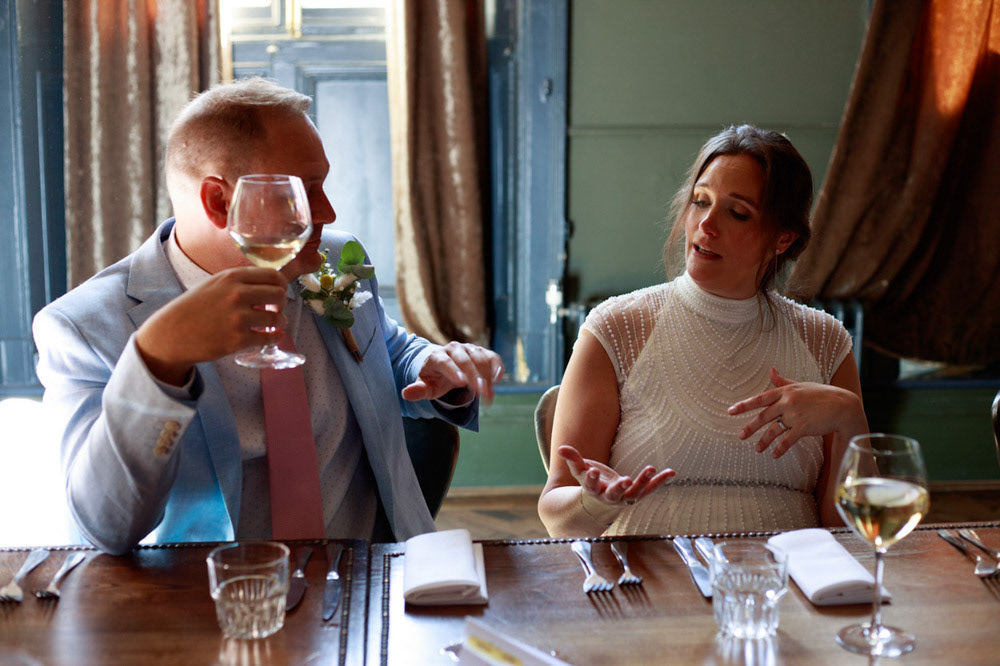Wedding couple chatting during the meal at Lost & Found in Leeds