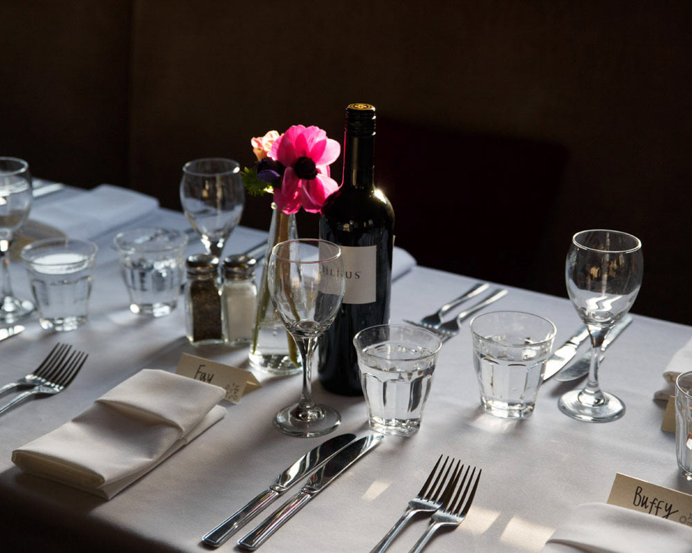 Wedding table setup at the Churchill Hotel with wine glasses and flowers