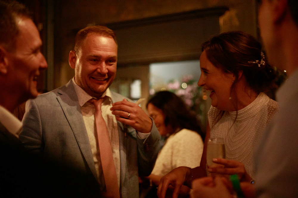 Groom joining Gemma to welcome their guests at the Club