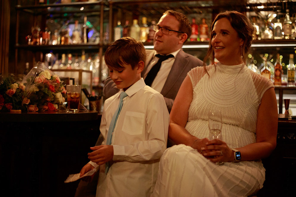 Groom’s son looks thoughtful before the wedding speech