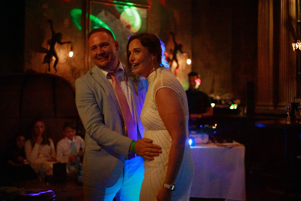 Bride and groom invite others onto the dance floor