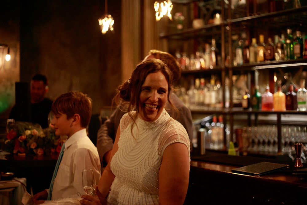 Bride smiling warmly at her friend during the speech