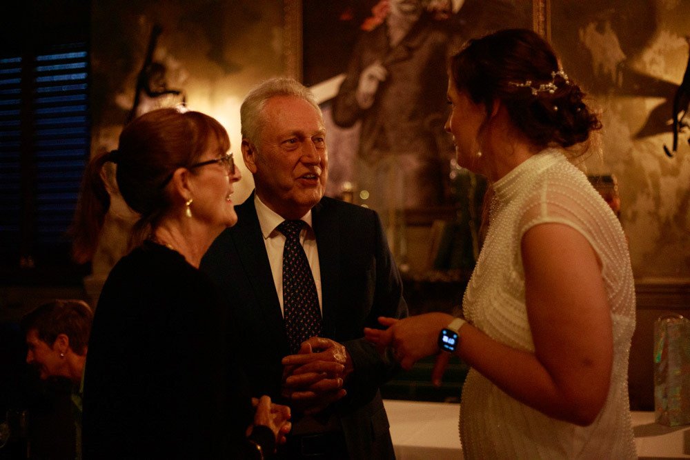 Gemma greeting guests as they arrive at the reception