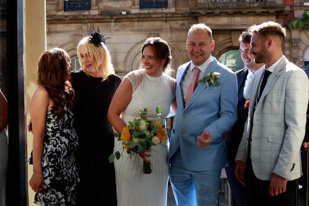 Fun group wedding photo with chatting family at Lost & Found Leeds