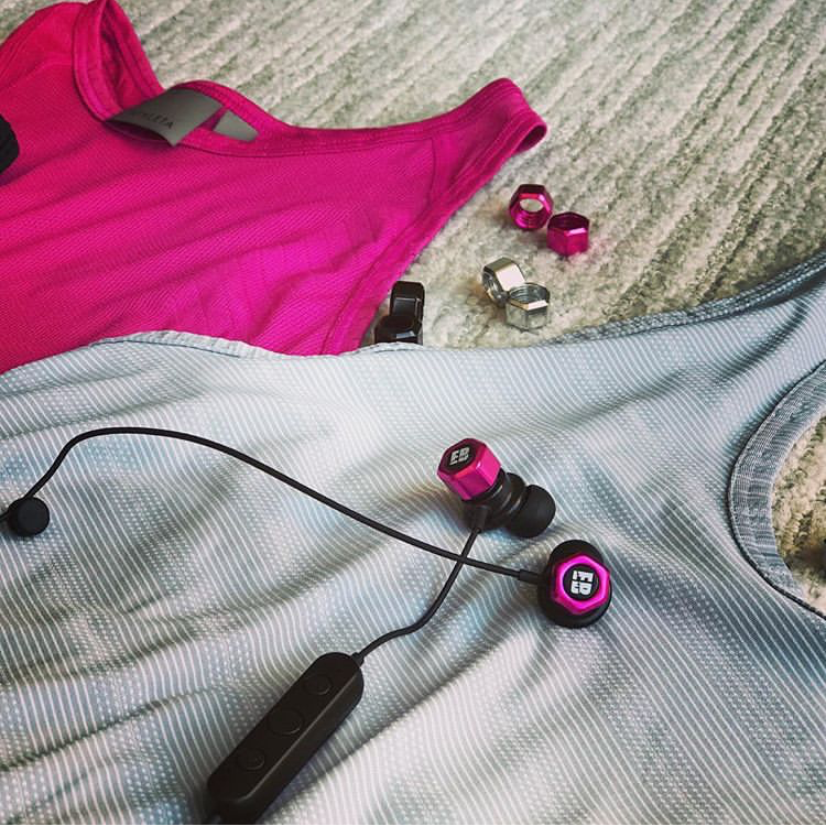Earbolt featuring a lifestyle photo of the Earbolt showing all parts, colors options