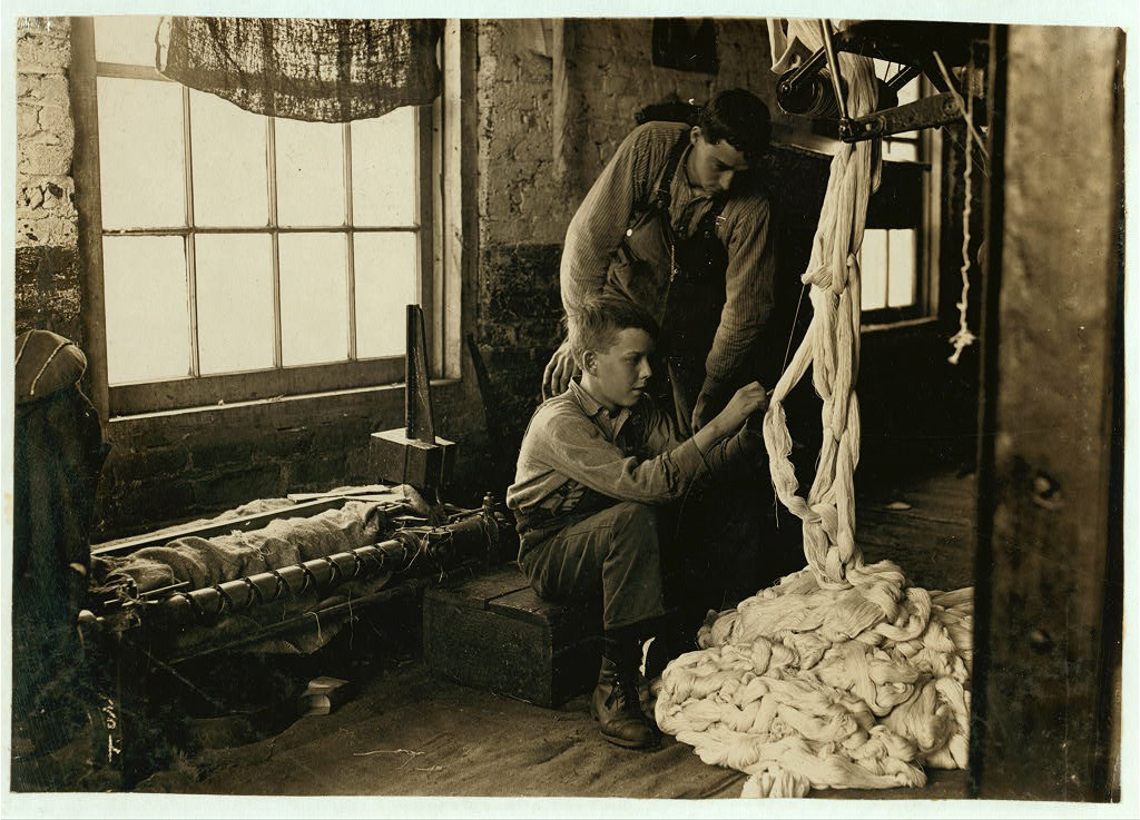Boy at warping machine. Been there 2 years. Clyde Cotton Mill. Location: Newton, North Carolina.