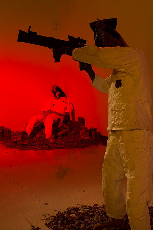 The uniforms are from veterans and they are painted white for the white art cube they are displayed in