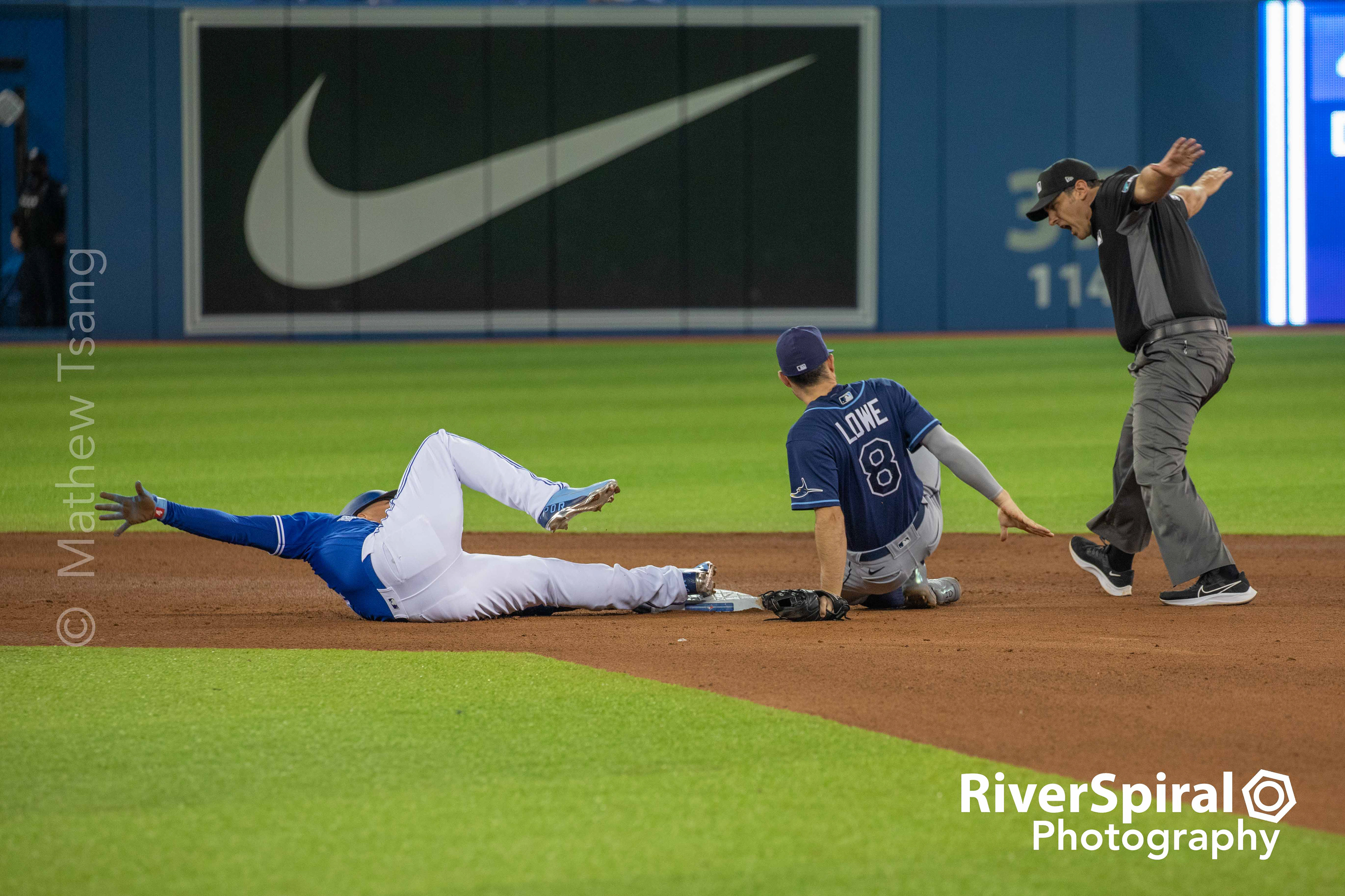 Holding on for a safe call at second base.