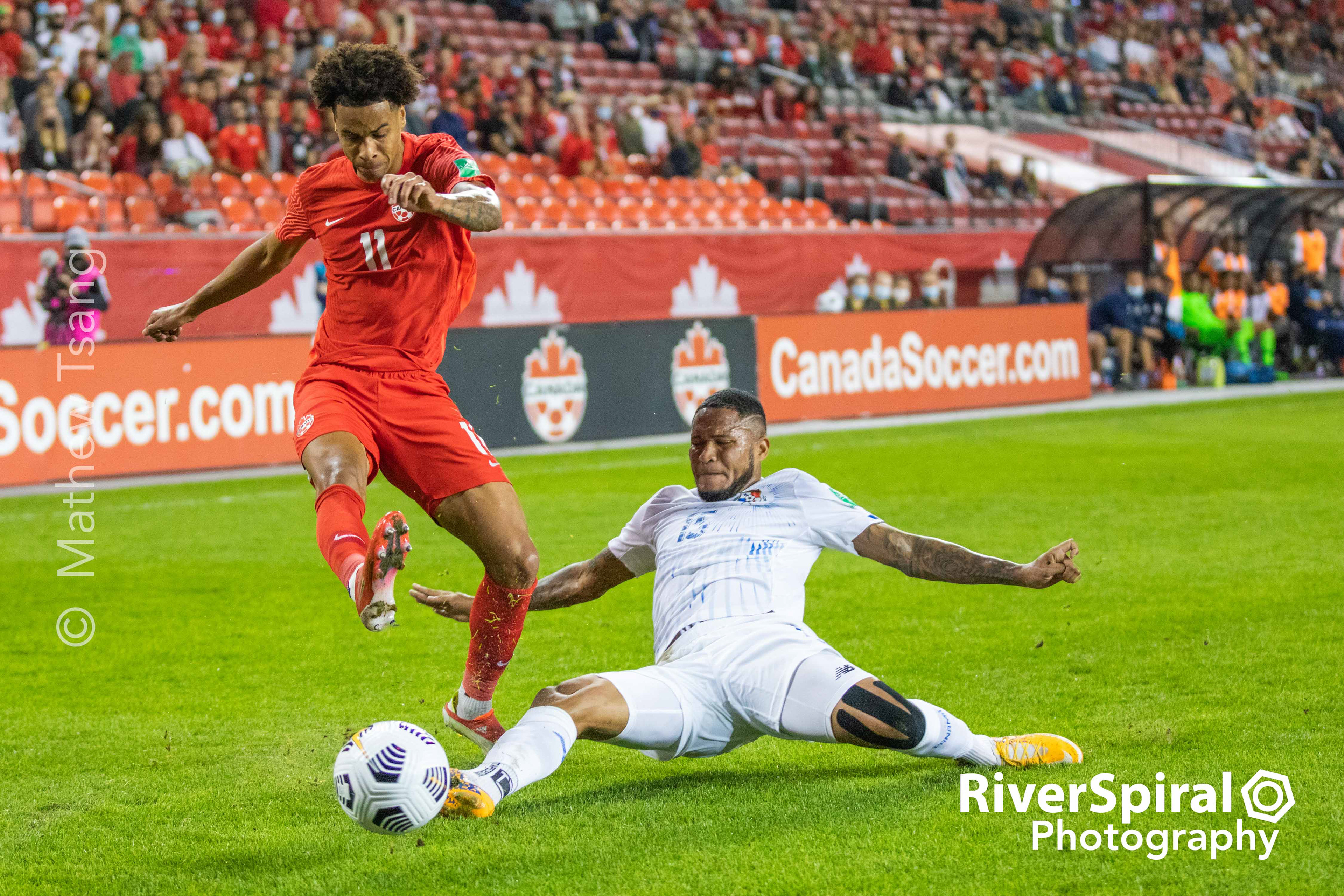 Team Canada Midfielder Tajon Buchanan (11) escapes a slide tackle by Team Panama Defender Eric Davis (15) in the first half of FIFA World Cup 2022 Qualifiers on Wednesday, Oct 13, 2021