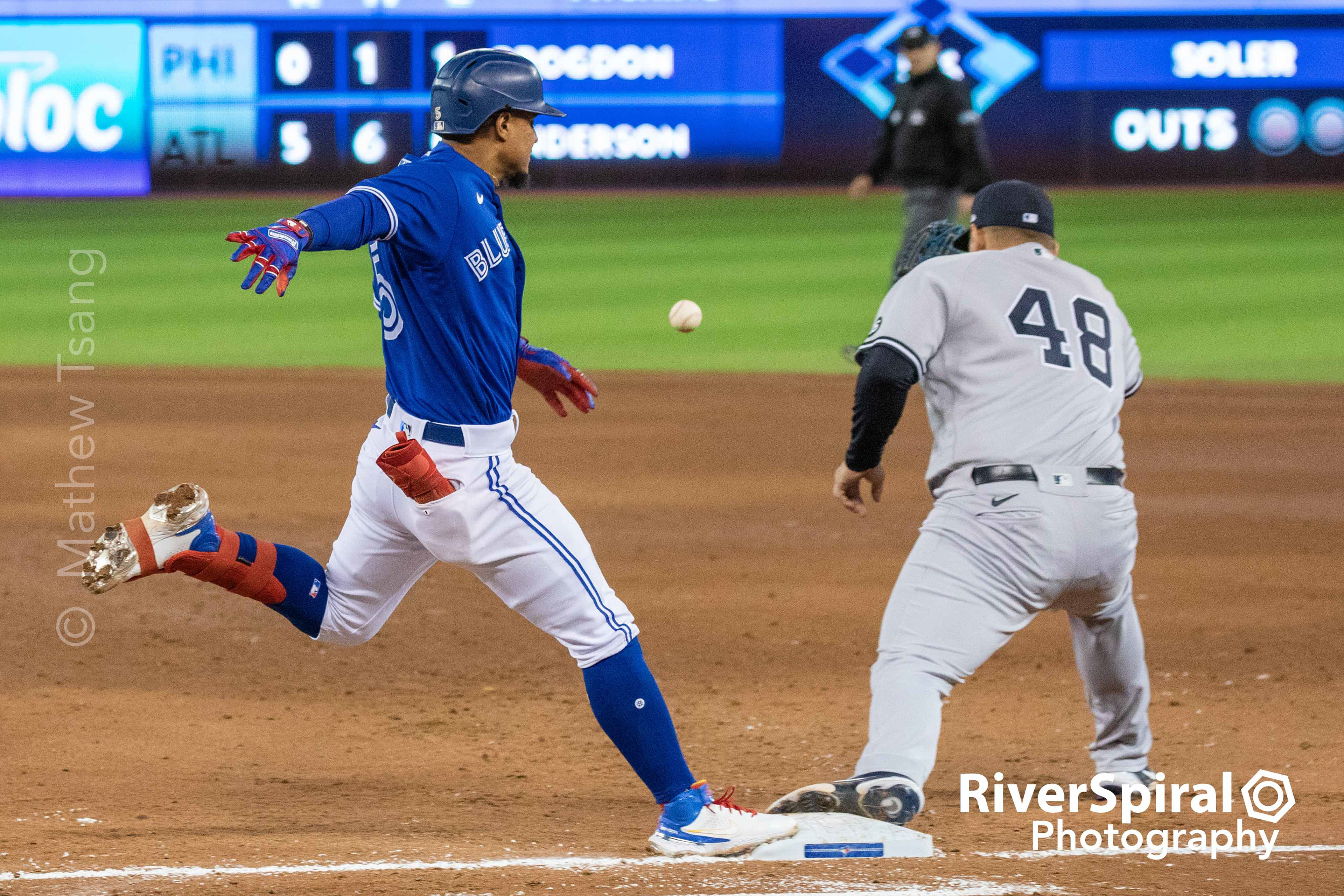 Toronto Blue Jays second baseman Santiago Espinal (5) stretches out an infield single in the bottom of the 6th inning in MLB American League baseball action against the New York Yankees in Toronto. Thursday, Sept. 30, 2021