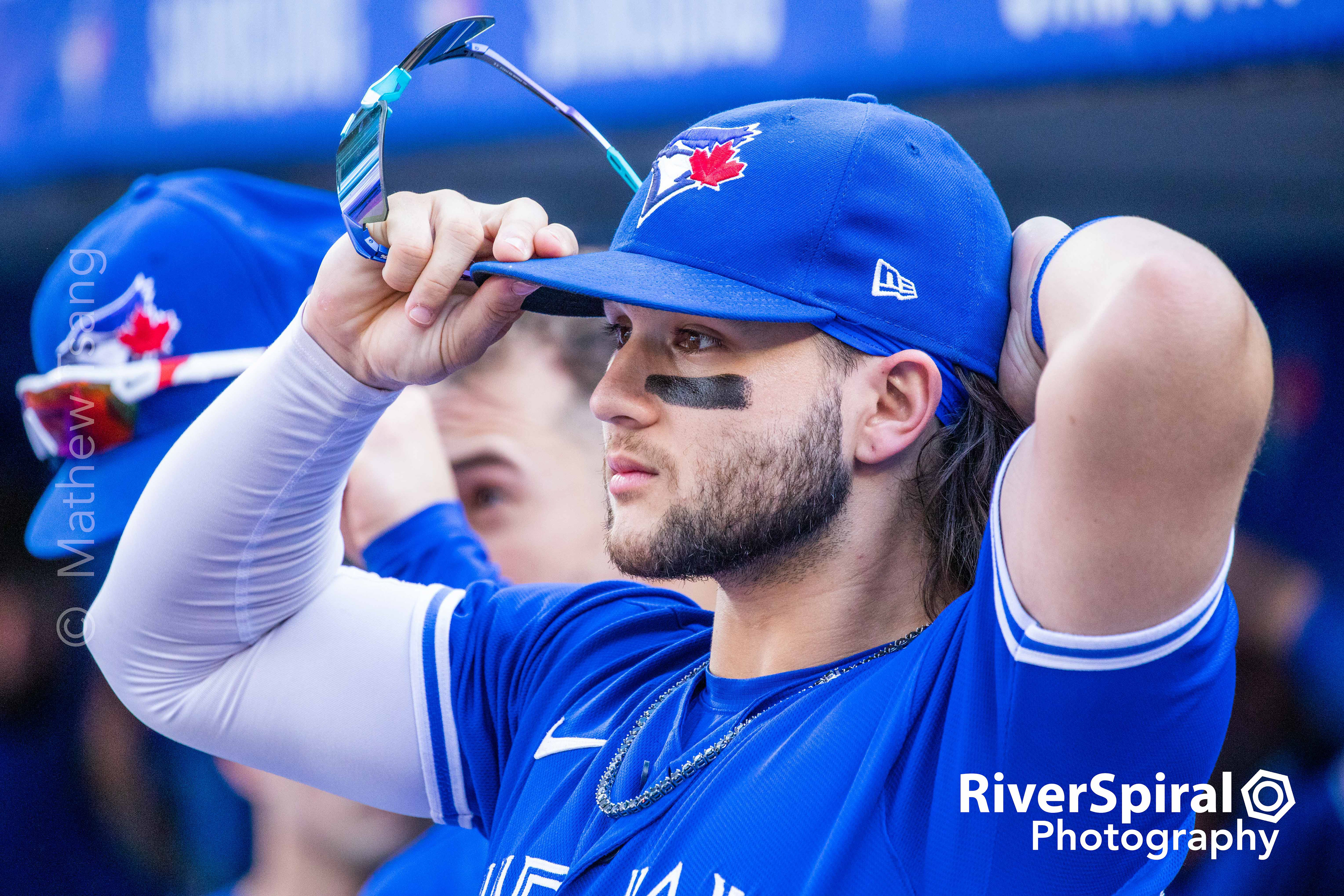 Toronto Blue Jays shortstop Bo Bichette (11) puts on his cap and sunglasses before the top of the 5th inning in MLB American League baseball action against the Baltimore Orioles, in Toronto. Saturday, Oct. 2, 2021