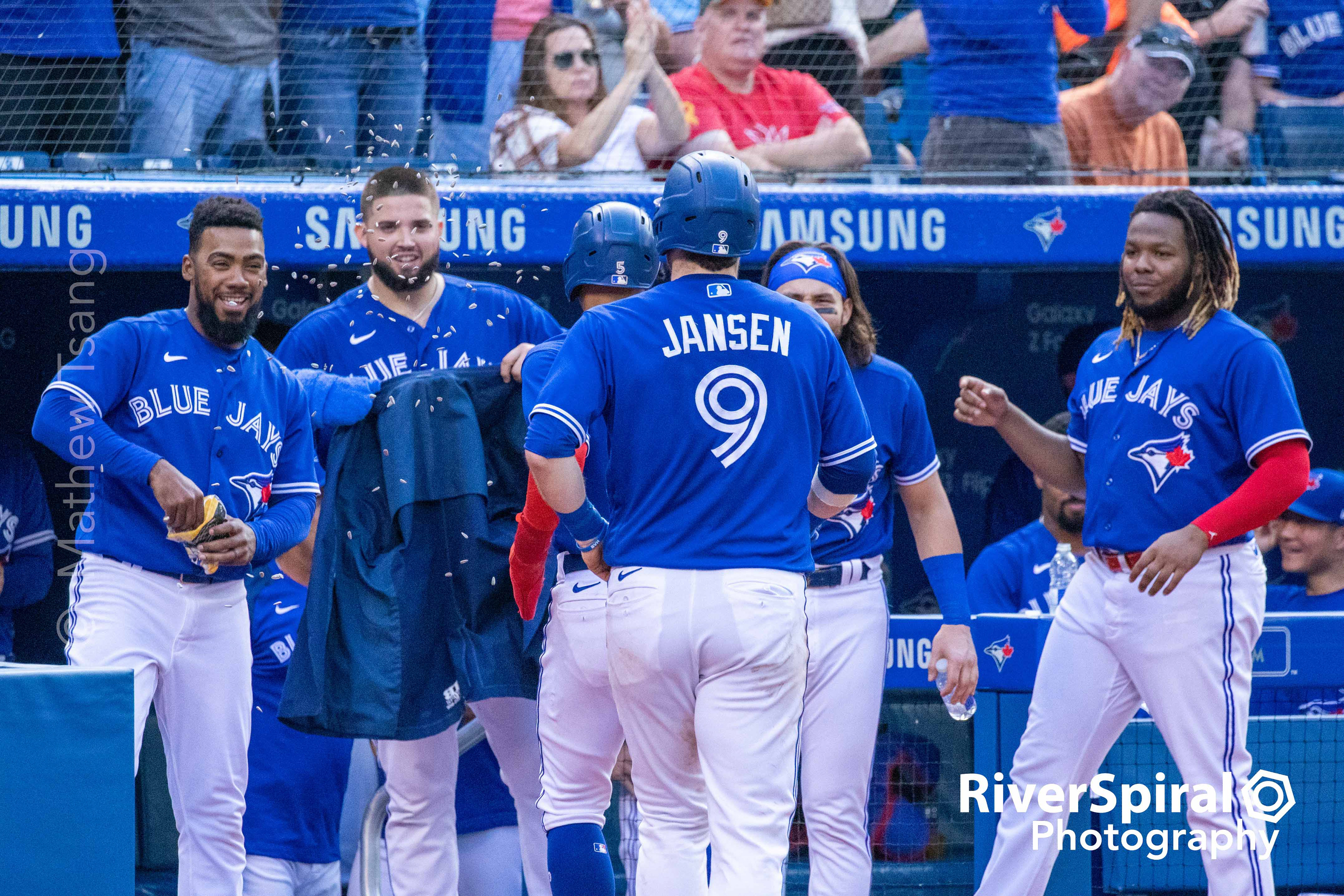 Toronto Blue Jays catcher Danny Jansen (9) is greeted with a Blue Jacket and a sunflower seed shower as he returns to the dugout after a 2-run homerun in the bottom of the 5th inning. The Blue Jays defeat the Baltimore Orioles 10-1 in Toronto. Saturday, Oct. 2, 2021