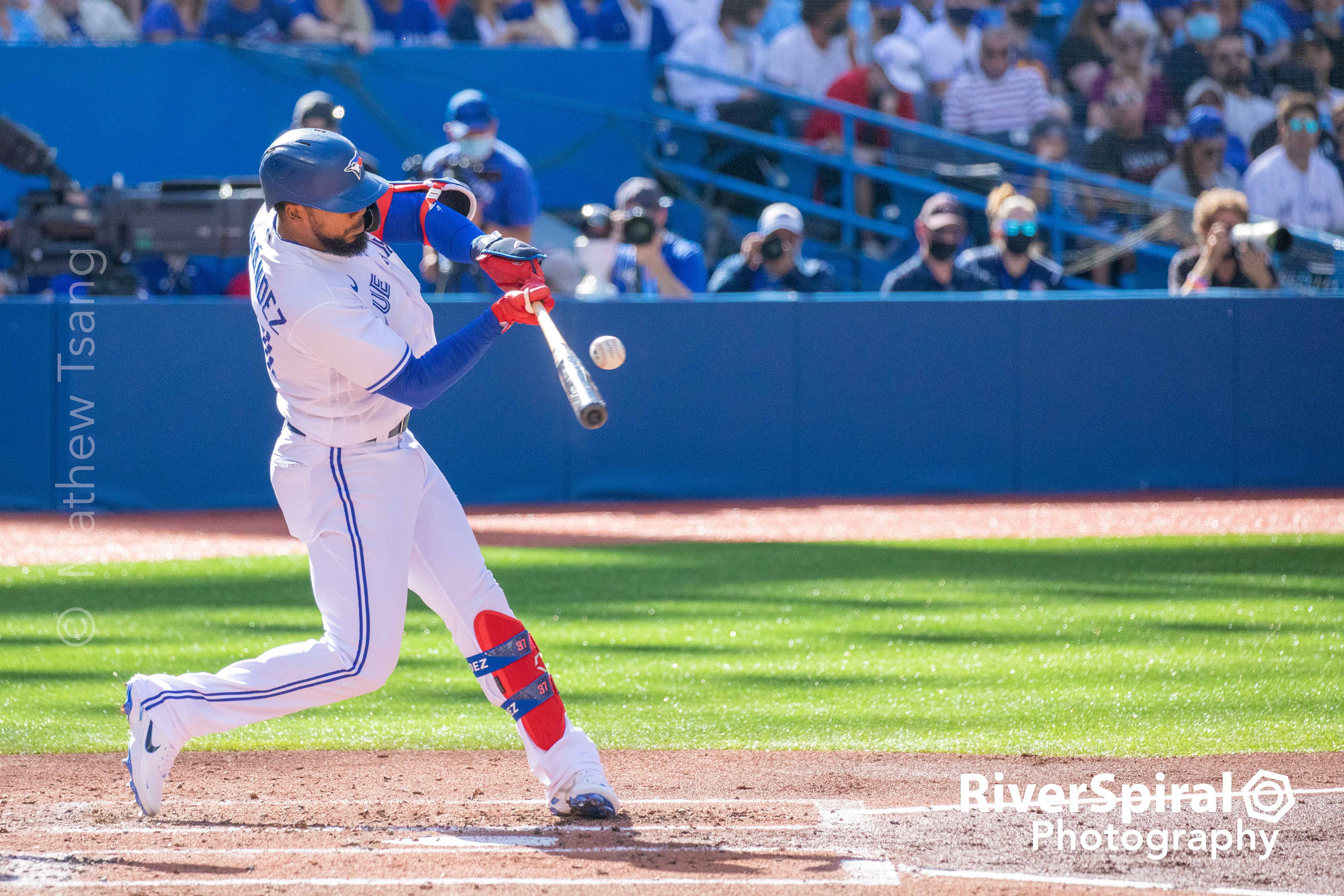 Teoscar Hernandez (37) makes contact.