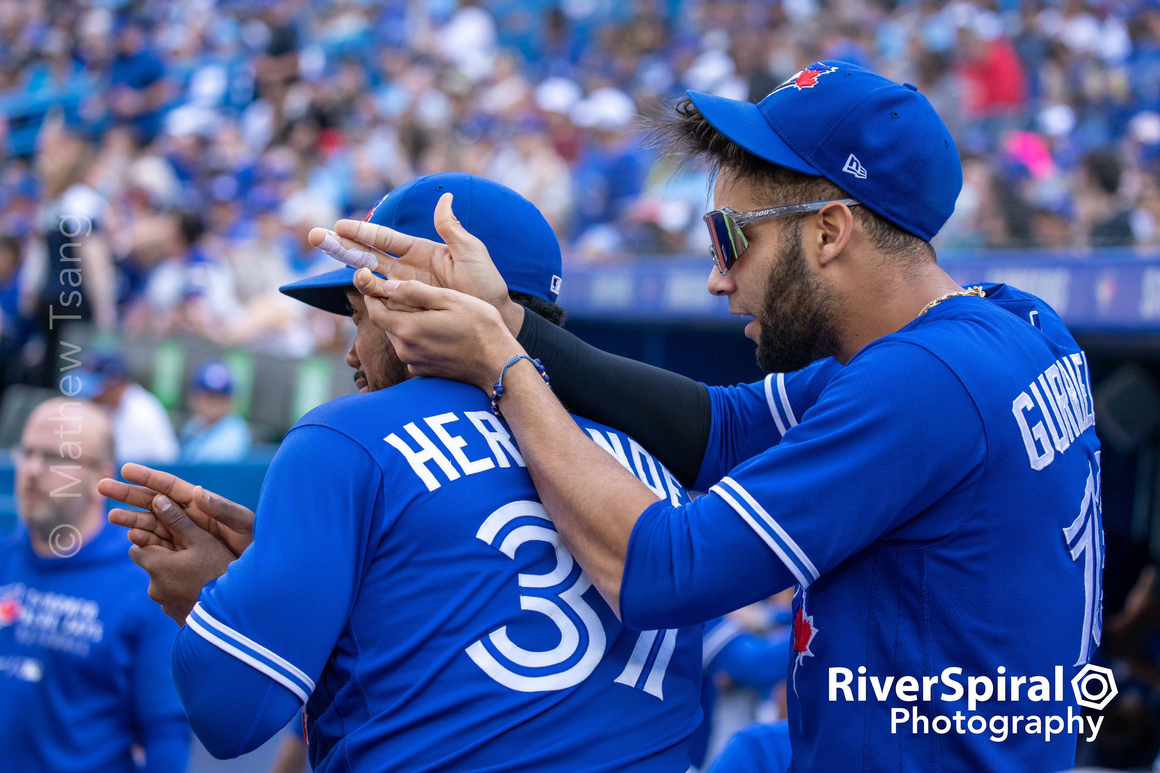 Toronto Blue Jays left fielder Teoscar Hernandez (37) and first baseman Vladimir Guerrero Jr. (27) observe fans in the 500 section. The Blue Jays defeat the Baltimore Orioles 10-1 in Toronto. Saturday, Oct. 2, 2021