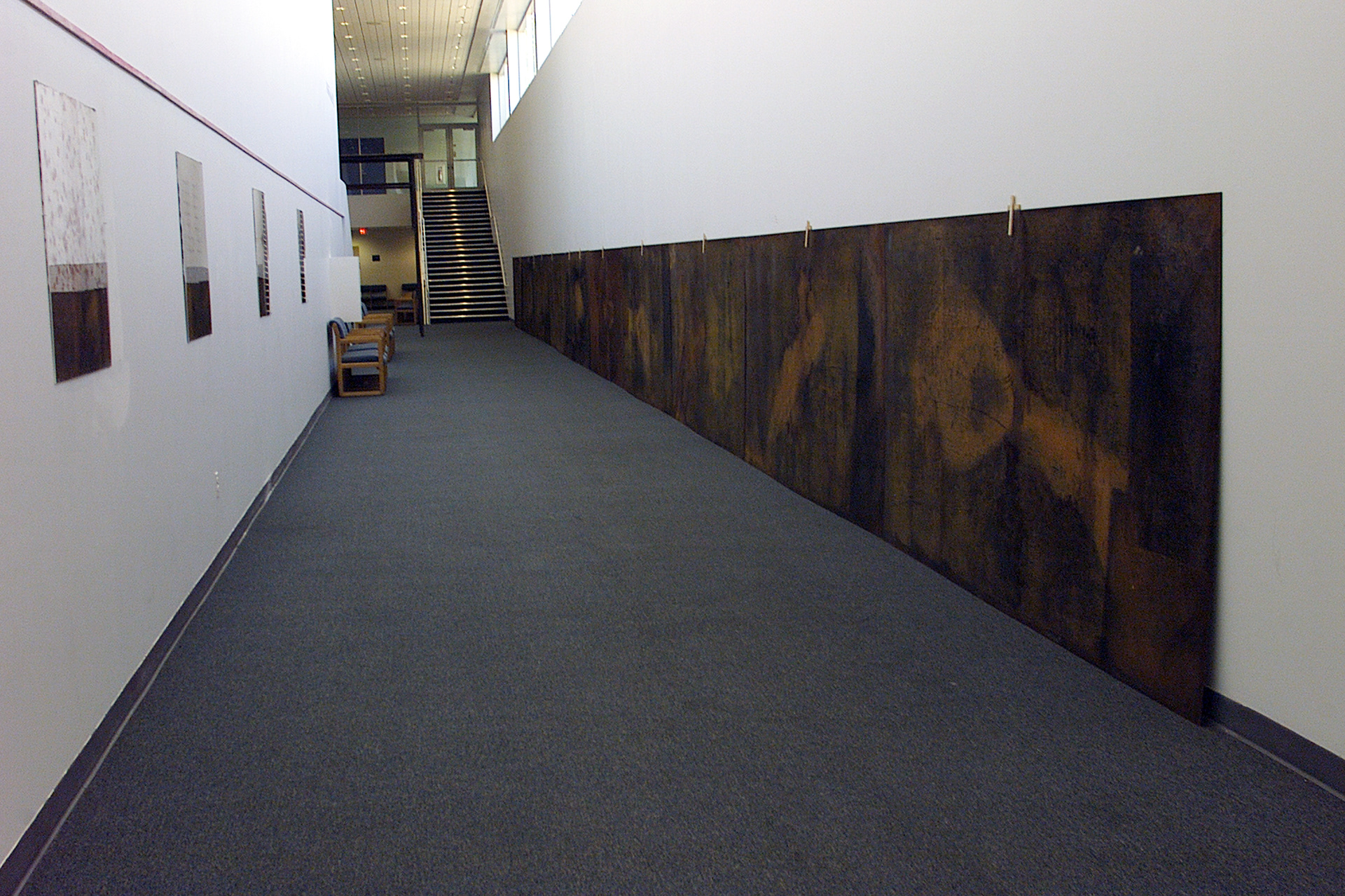 Partial view from the exhibition "Misa negra". wood, metal. installation. variable dimensions