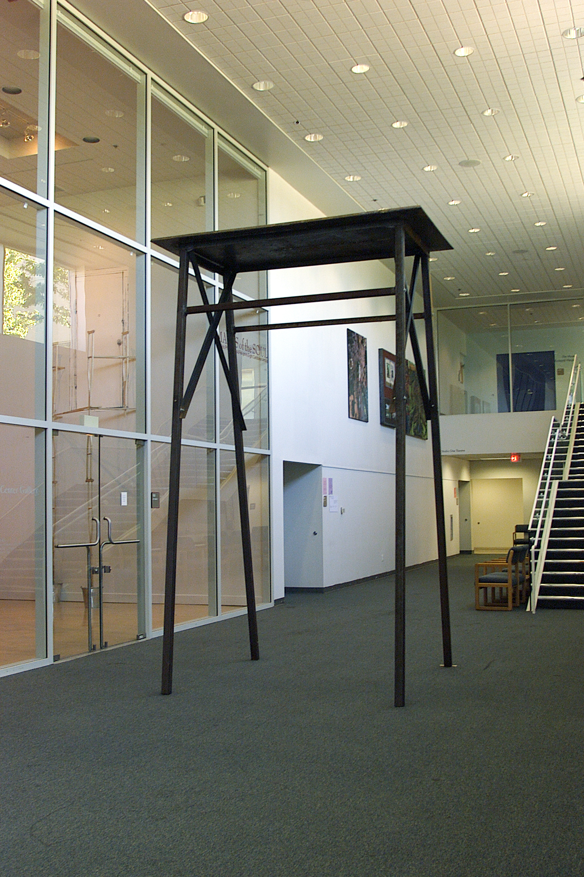 Partial view from the exhibition "Misa negra". wood, metal. installation. variable dimensions