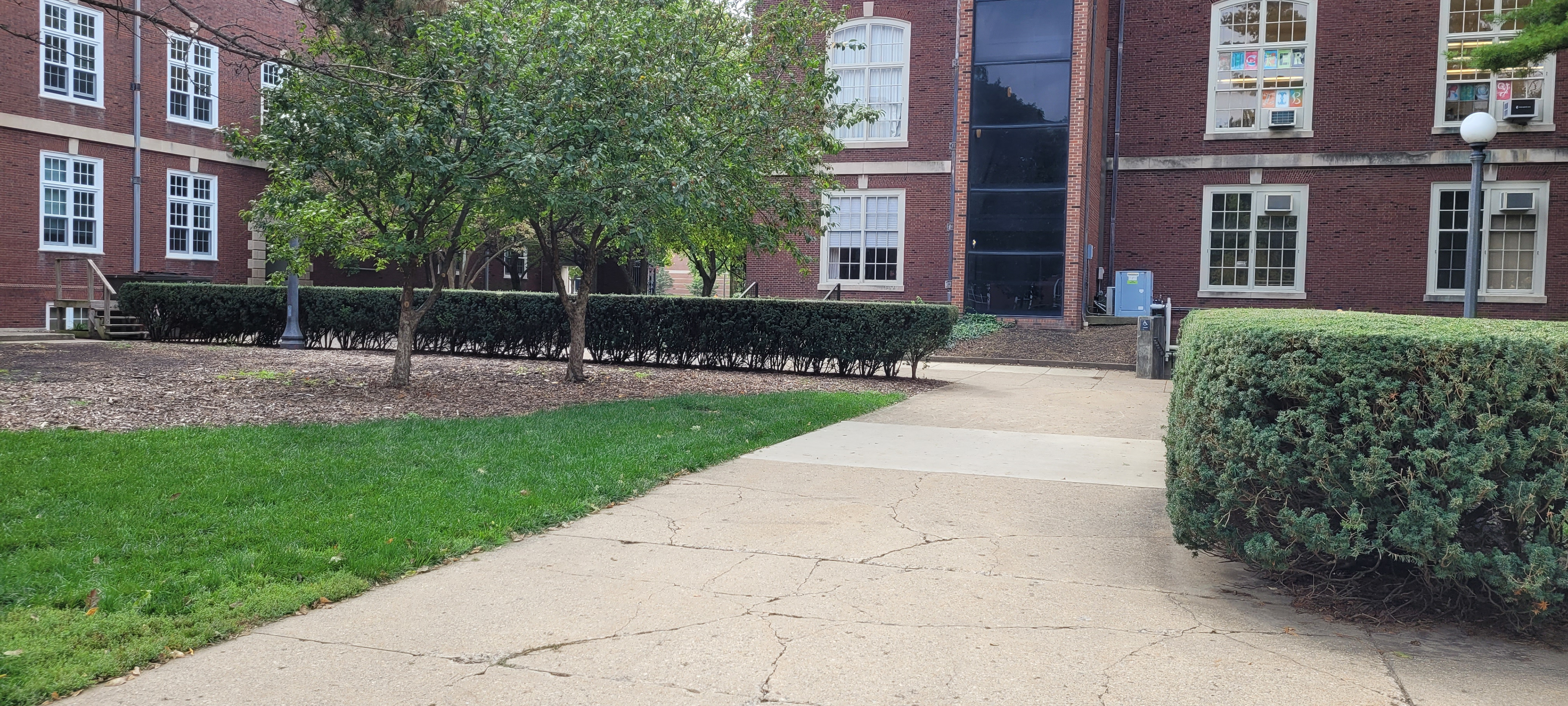 The large hedge blocks sightlines into the courtyard space