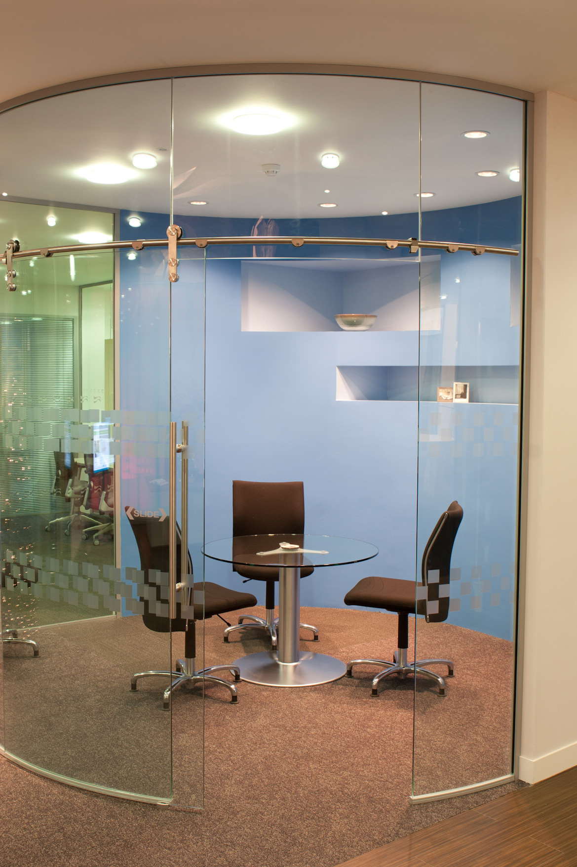 Curved glass meeting room