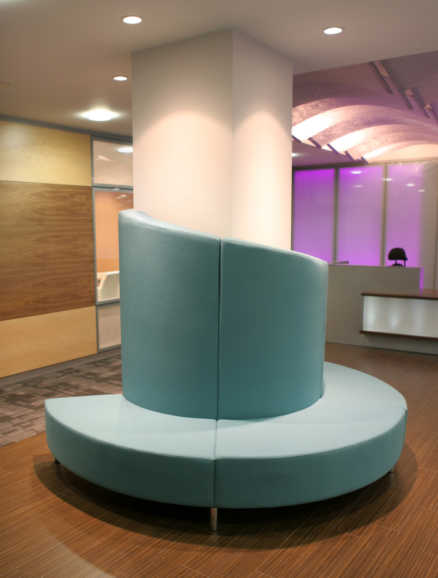 Bespoke designed sofa to wrap around the column