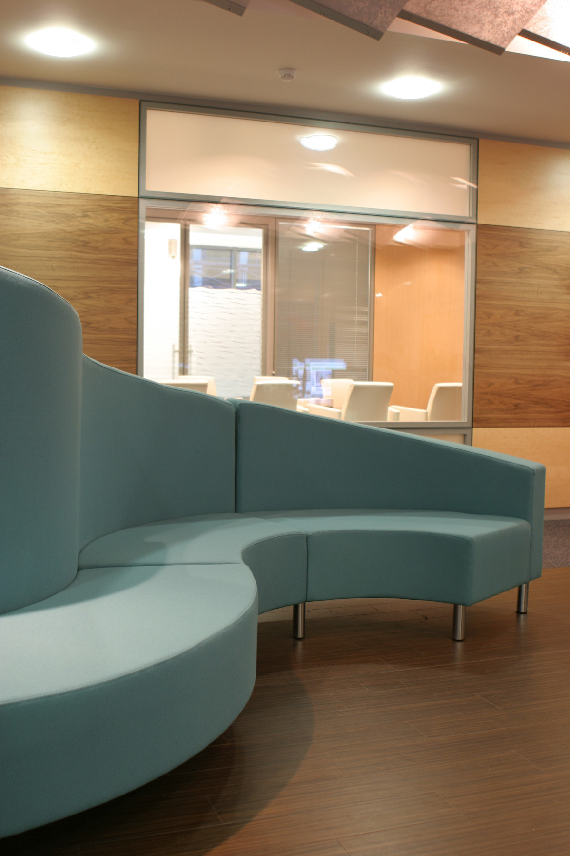 Bespoke designed sofa to wrap around the column